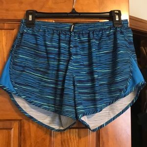 Blue Nike running shorts